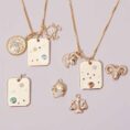 Constellation-Charm-Necklace-styled-and-layerd.jpg
